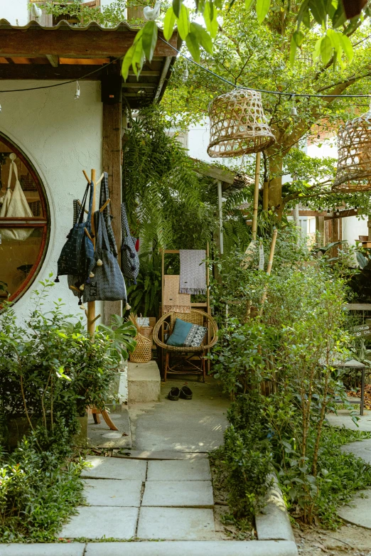 a small garden area with clothes hanging on a wire