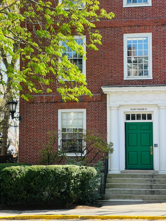 the front door and steps to an apartment building