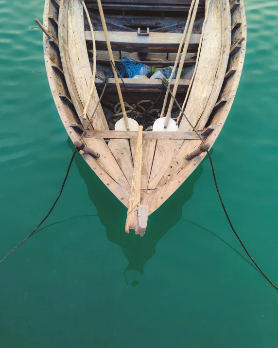 the bottom part of a boat is in a body of water