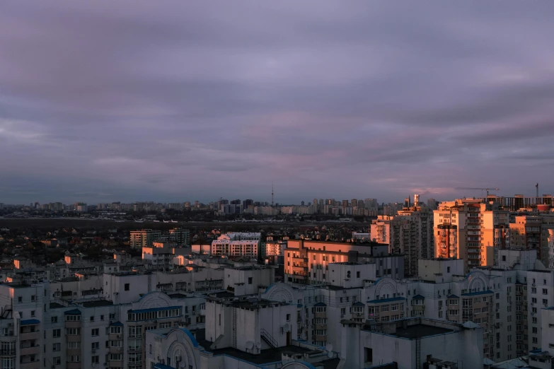 a big city that is under some cloudy sky