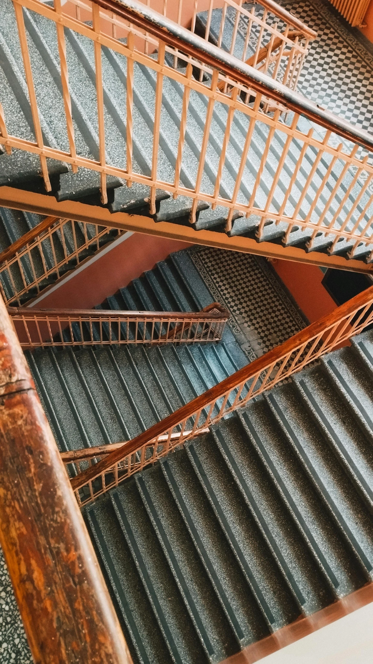 spiral staircases going up in a building, viewed from above