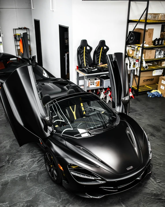 a sports car in the garage that is getting ready for its next ride