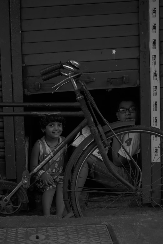 a couple of people holding up some bikes