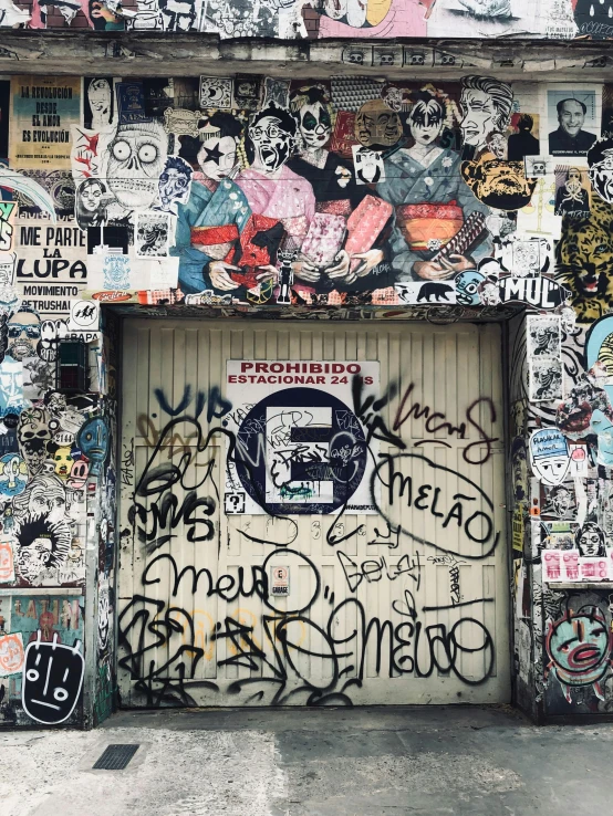 a garage door is covered with colorful graffiti