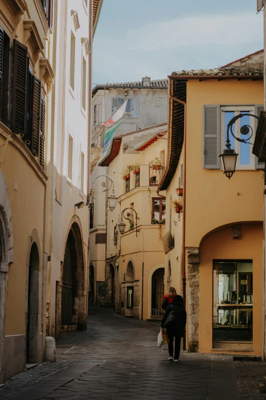 a couple is walking together on an alley way