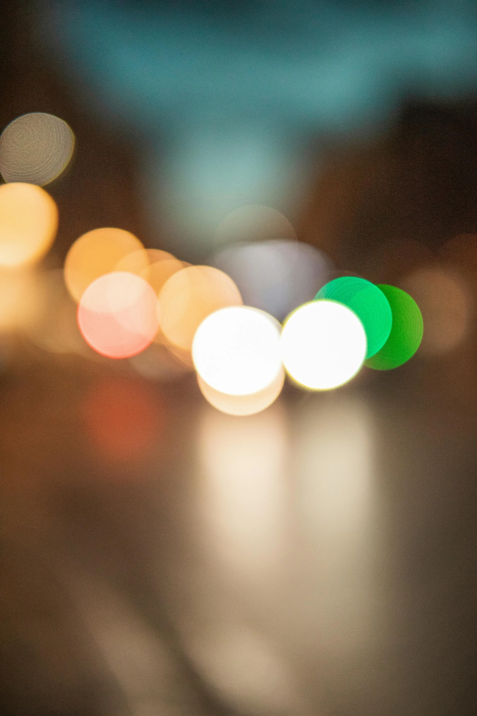 a blurry po shows a green traffic signal