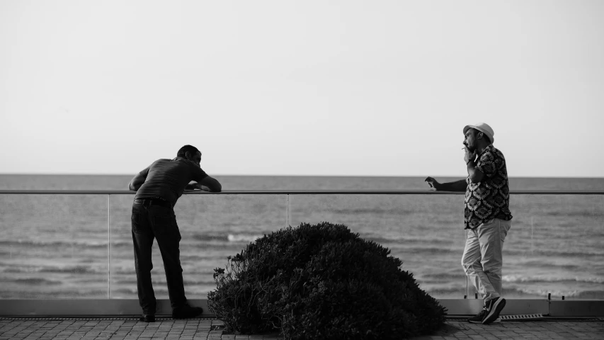 two people looking out at a body of water