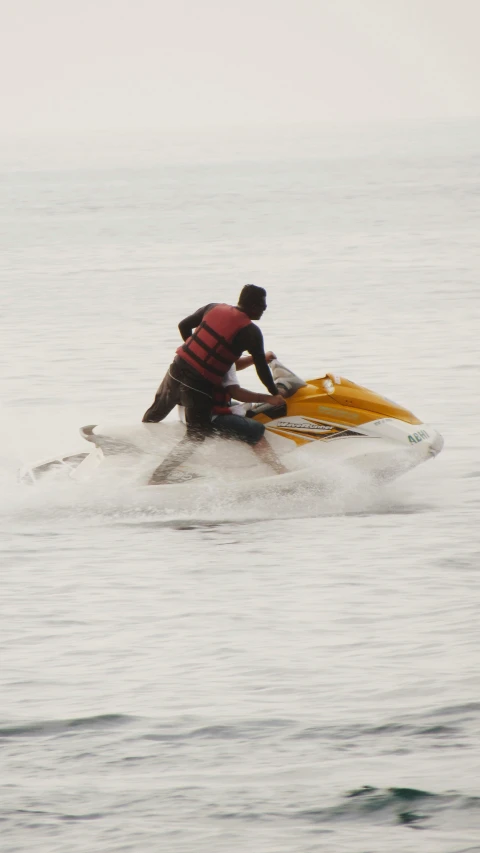 a man is on water skis while riding in the ocean