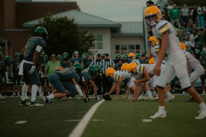 a football game with the players blocking