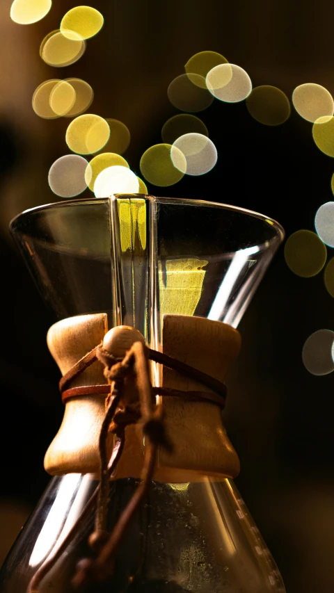 a decorative glass jug holding a tiny object