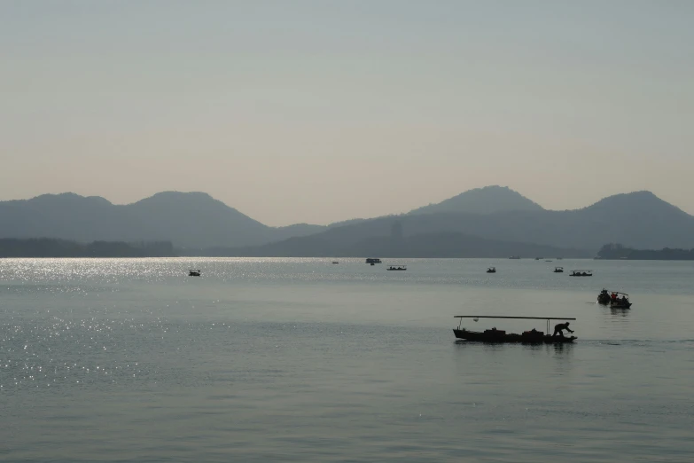 the people are rowing in small boats through the water