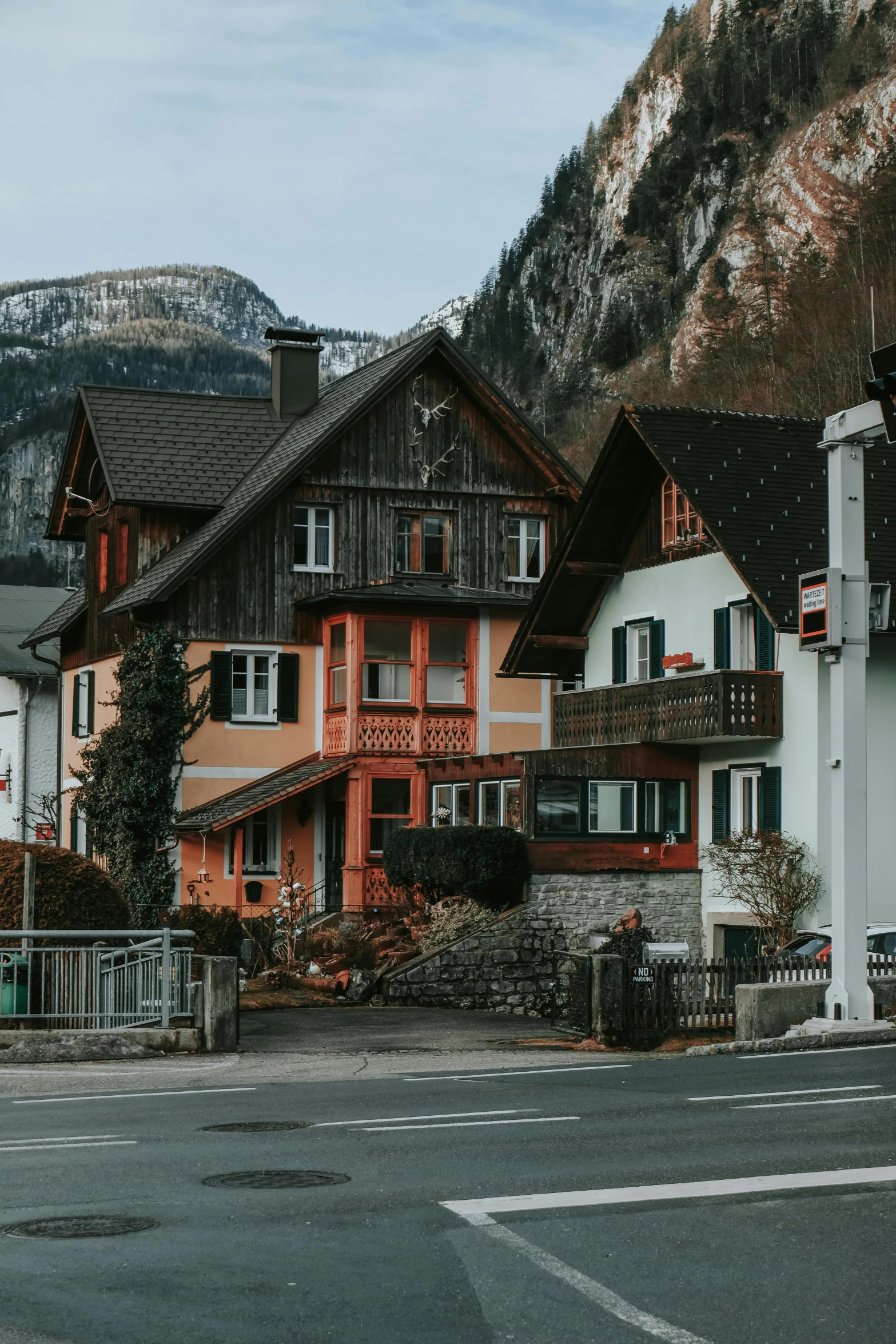 two houses sit in the middle of a small town