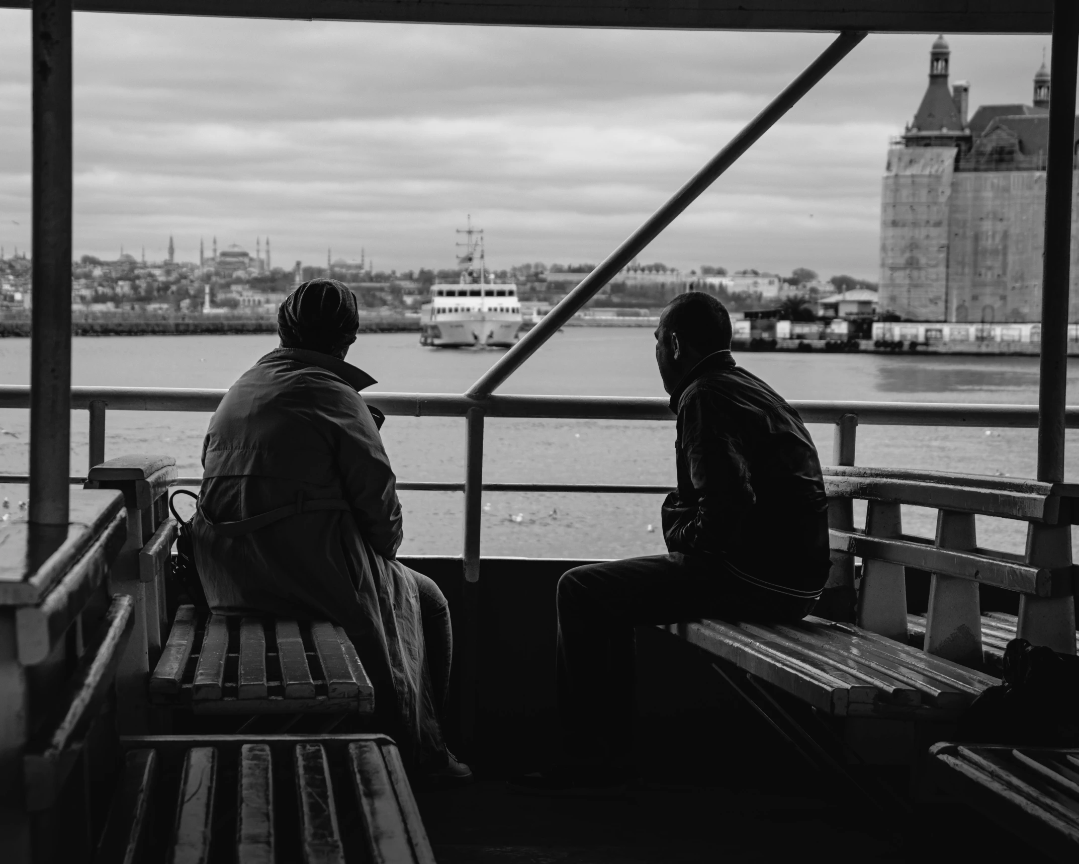 a couple of people are sitting on a boat