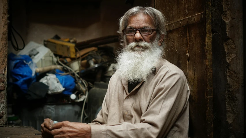 a man with grey hair and a long white beard