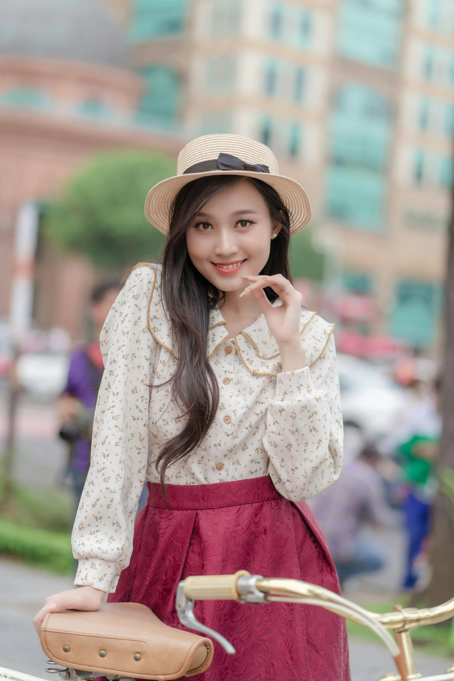 a girl posing next to a bicycle for the camera