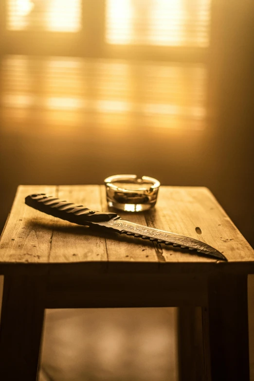 a table with a ring, comb and a spoon on it