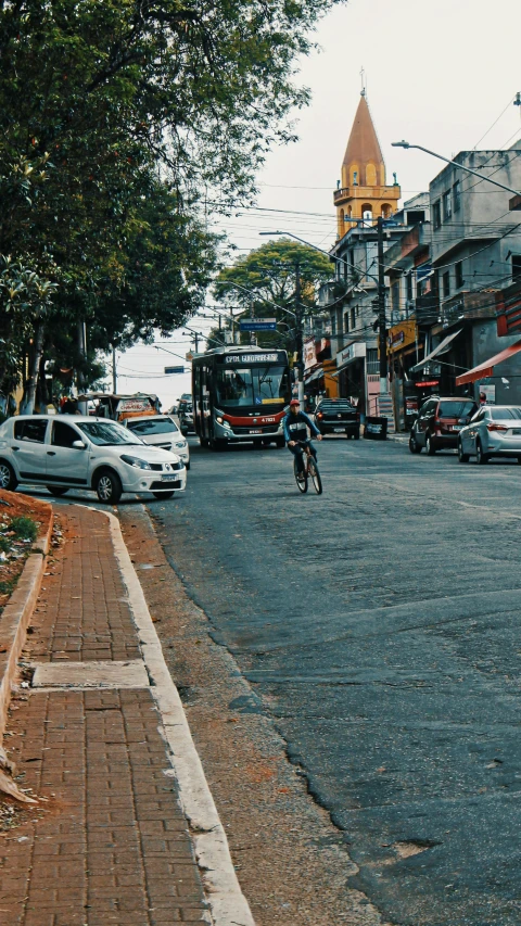 there is a motorcycle and car in this city street