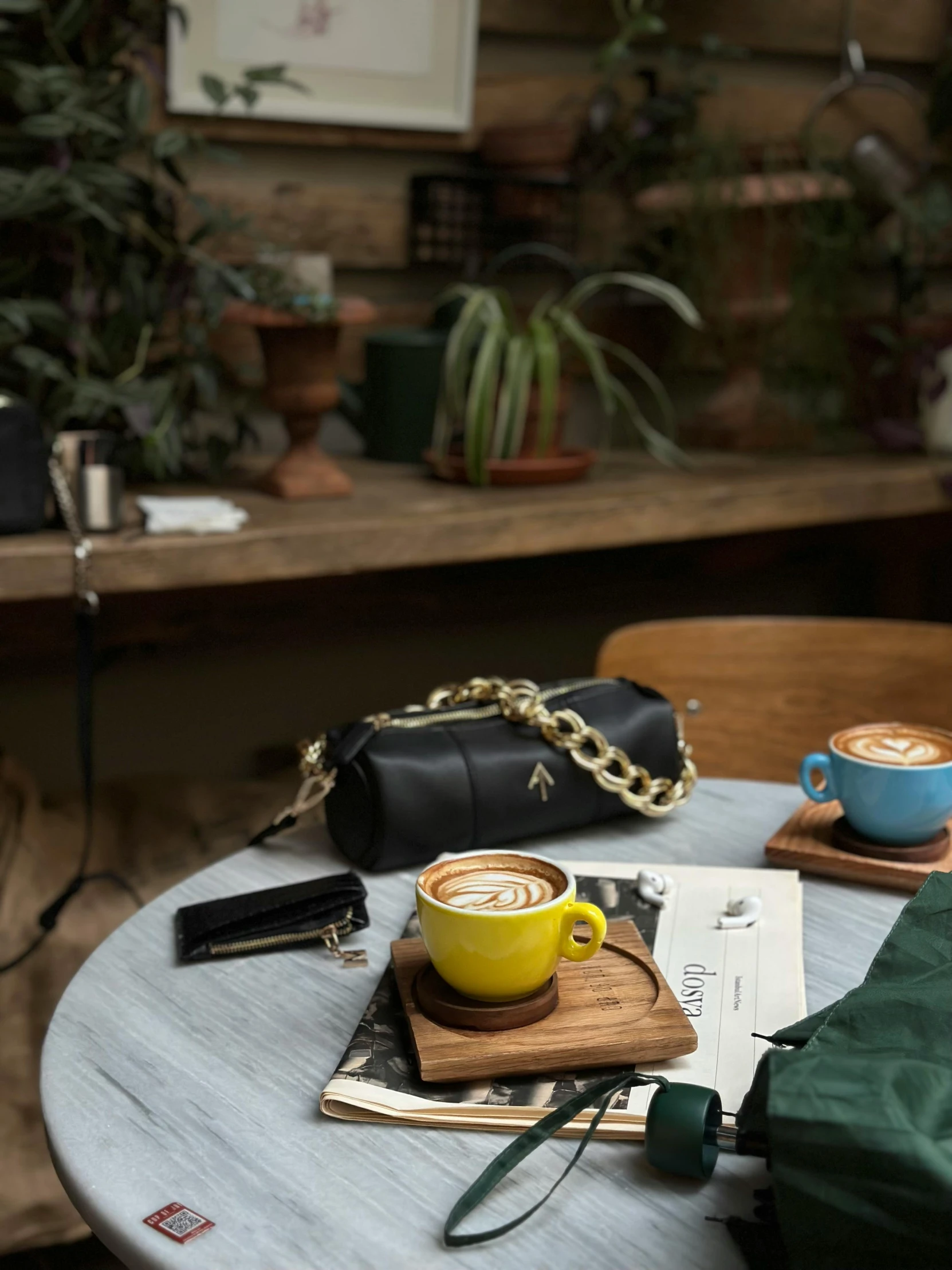 a cup of coffee sitting on top of a table