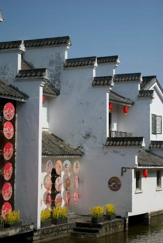 a store has umbrellas over the doorway and windows