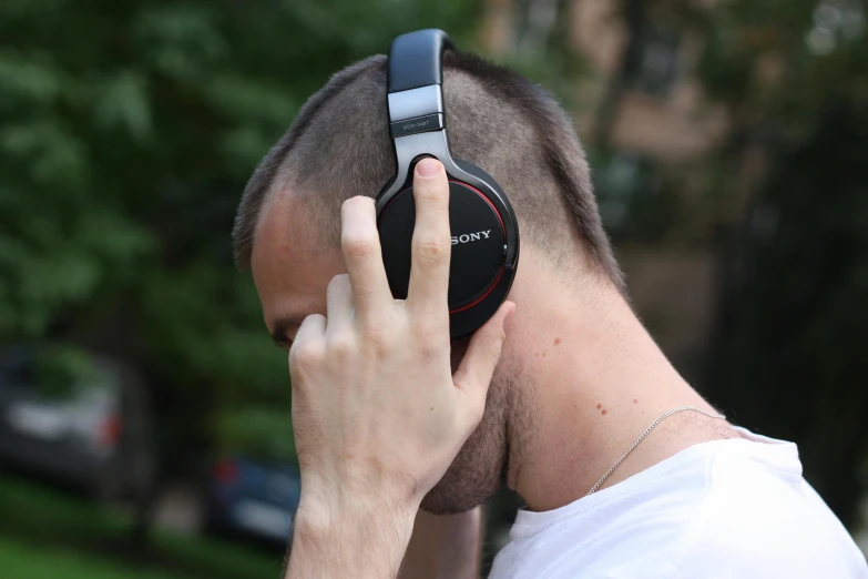 a man with headphones on looking off to the side