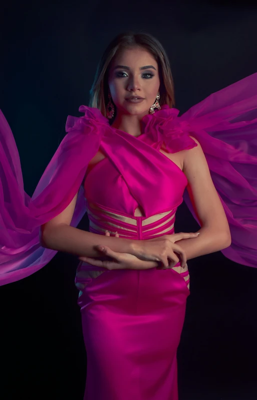 a woman posing in a  pink dress