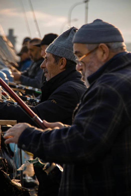 a group of men sitting on top of a boat