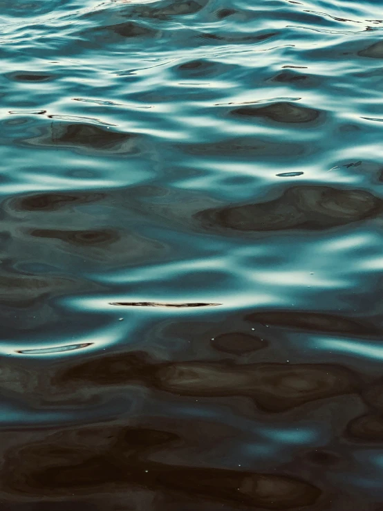 waves that are in the water and some rocks