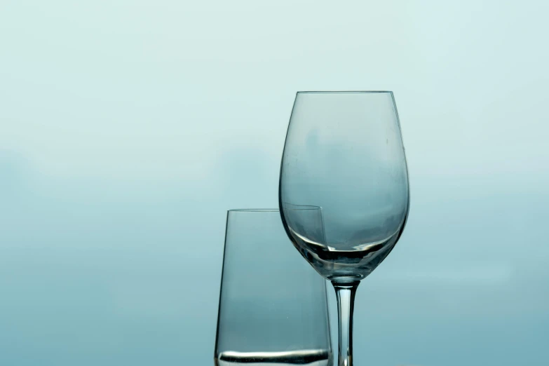 a couple of wine glasses on a table