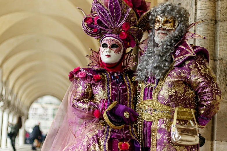 a couple of people wearing costume in a building