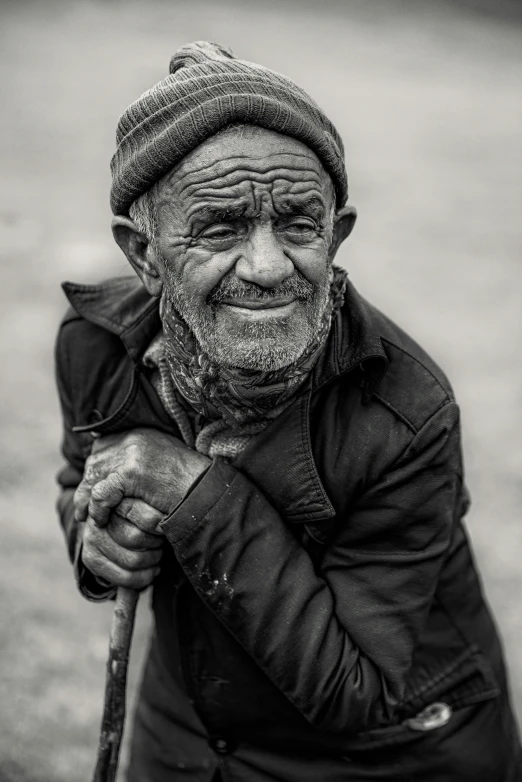 a old man with an old scaffold on his shoulder