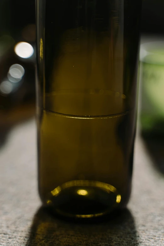 the top half of a bottle of liquid on a table