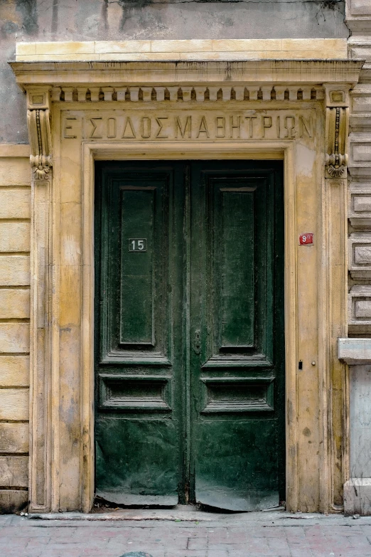 the doorway to a tall building has the letters,'aham lincoln,'and's initials