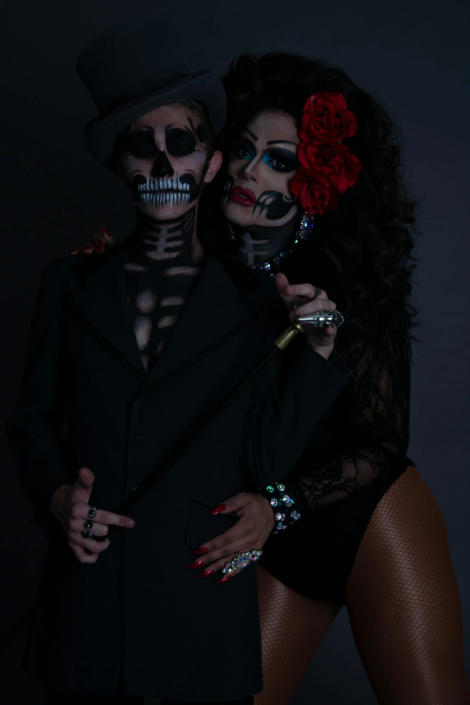 two beautiful women dressed as skeleton bride and groom