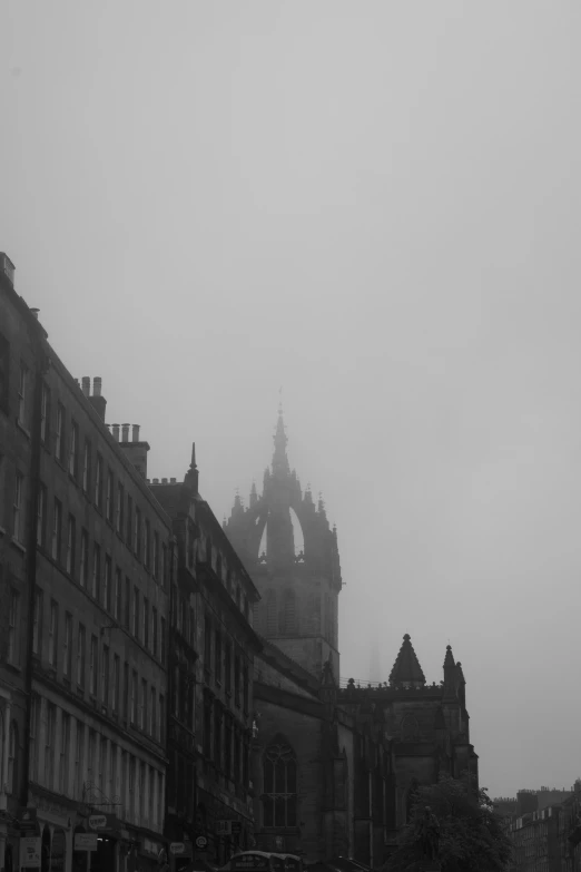 an old stone castle rises above the city streets