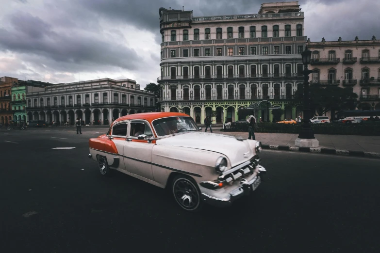 the old classic car is parked by itself