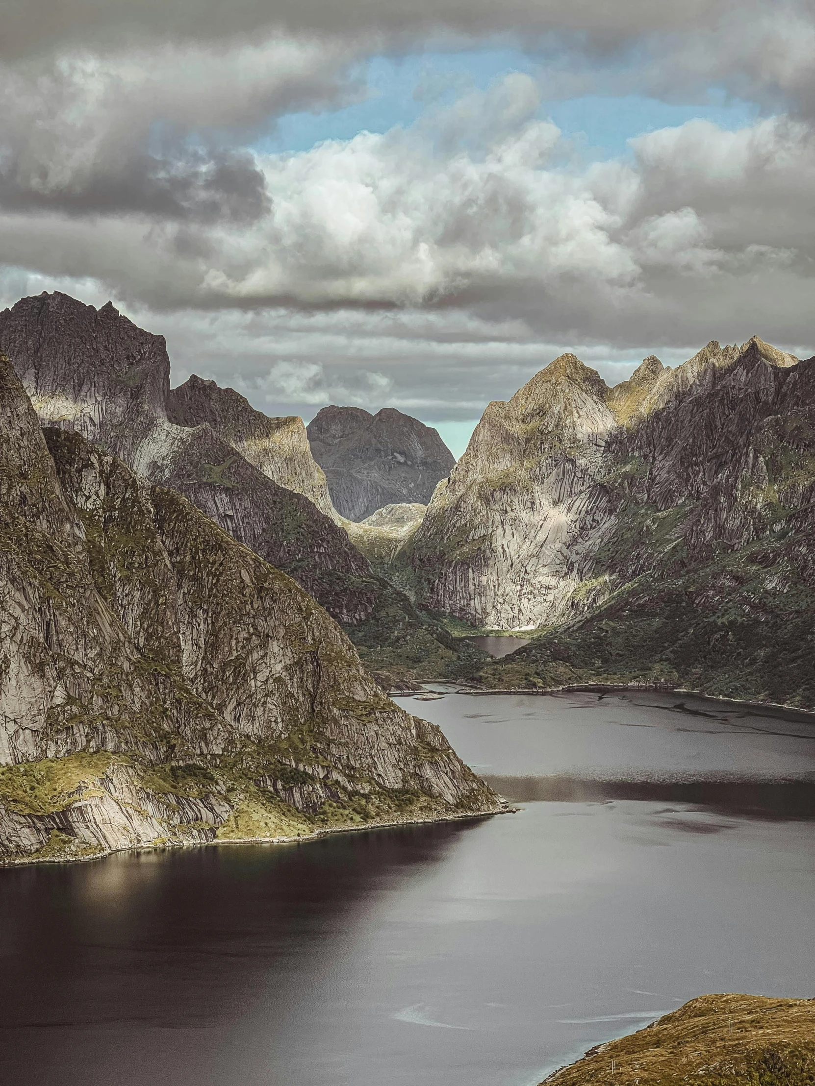 mountain range covered in a very cloudy sky