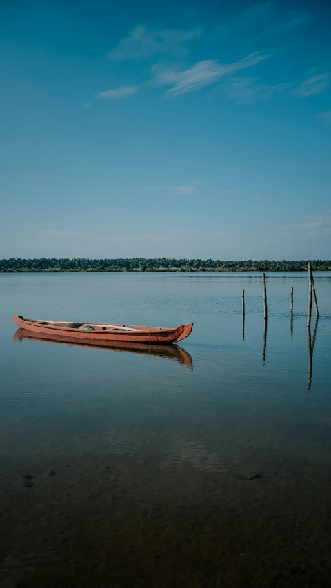 a person in a canoe sitting in the water