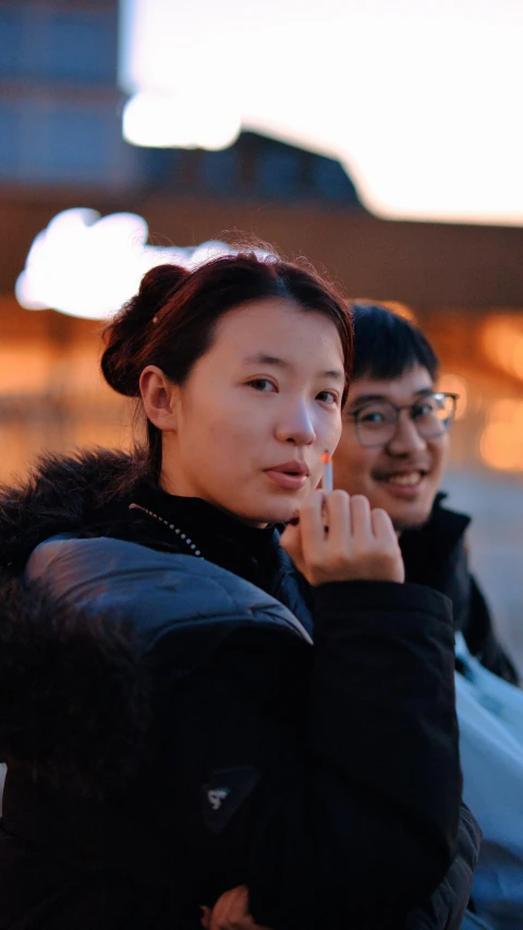 a couple is sitting on the side of the road