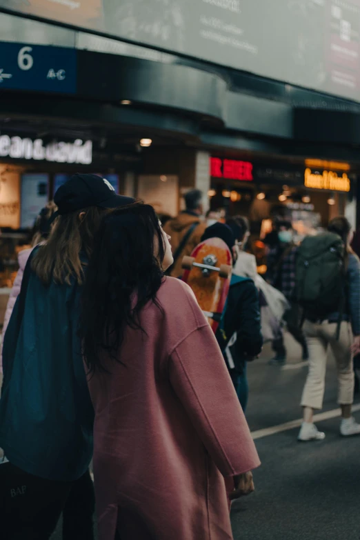 several people are standing in line at the airport