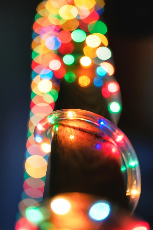 bright lights adorn a glass and cone on a table