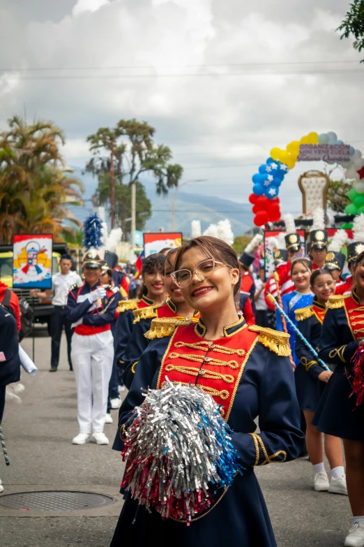 children dressed in cheerleader attire with big ears at outdoor event