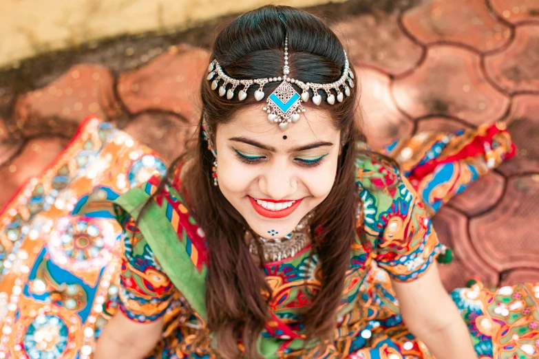 a woman in a colorful headdress and a necklace