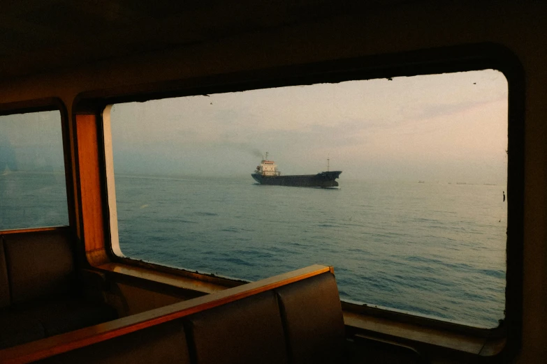 a boat out in the ocean with a boat in the water by itself