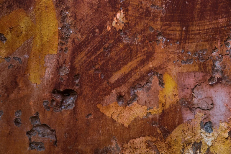 a peeling paint design on a rusted metal structure