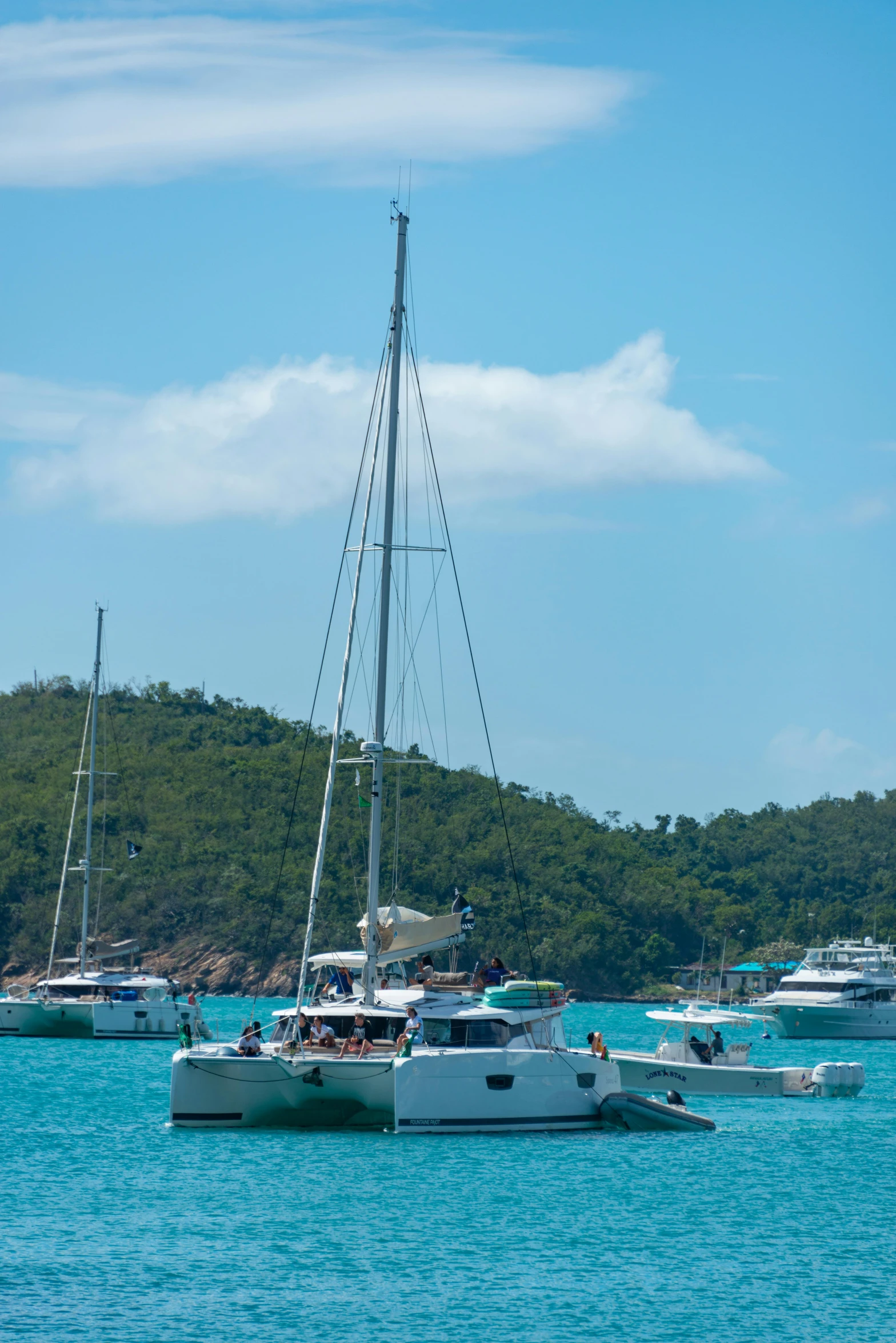 there are many small white boats sailing in the water