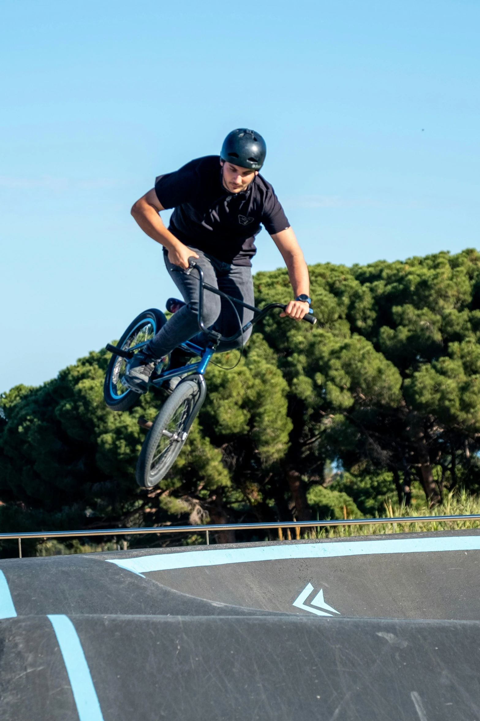 a man flying through the air on top of a dirt bike