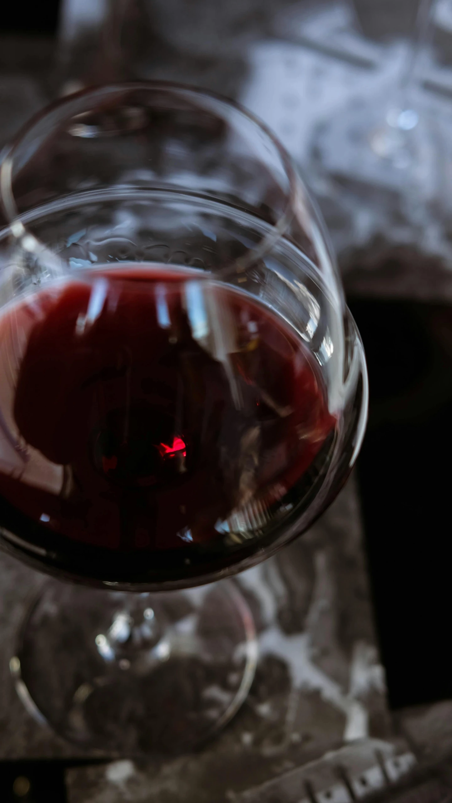 a close up view of a wine glass with wine in it