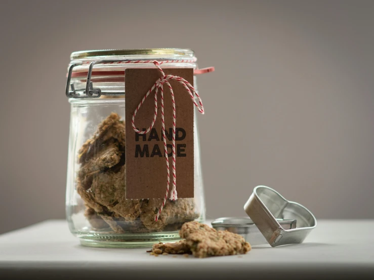 cookie doughnuts are displayed in a glass jar