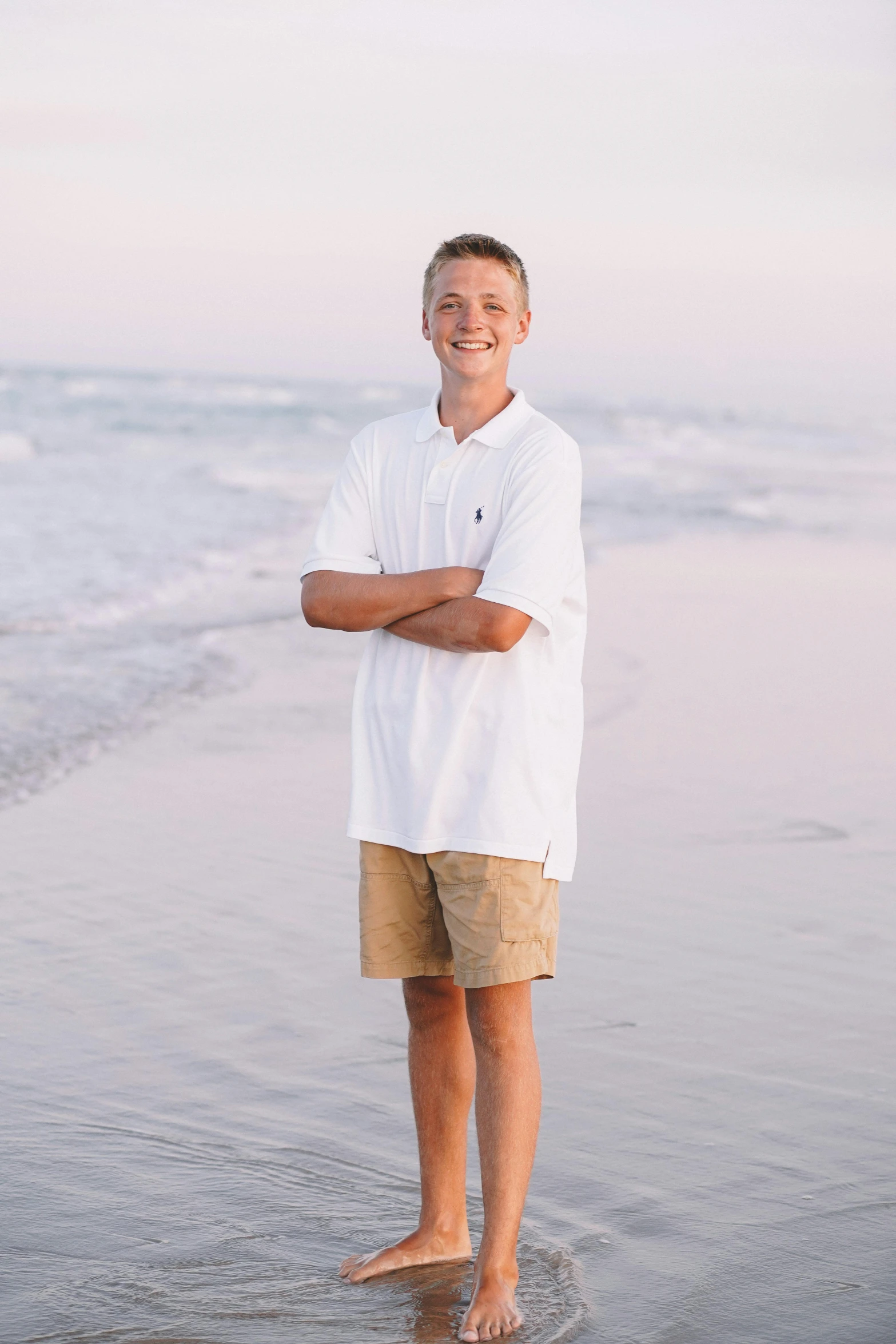 a man stands on the edge of the water