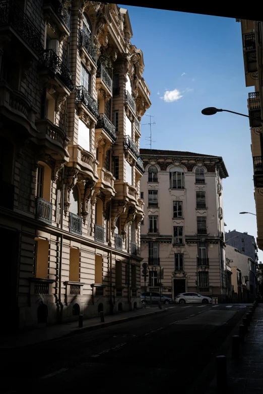 the buildings are lined up near each other on the street